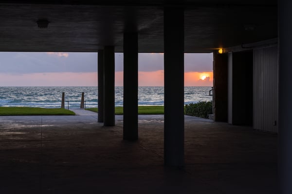 covered patio looking out at ocean green lawn