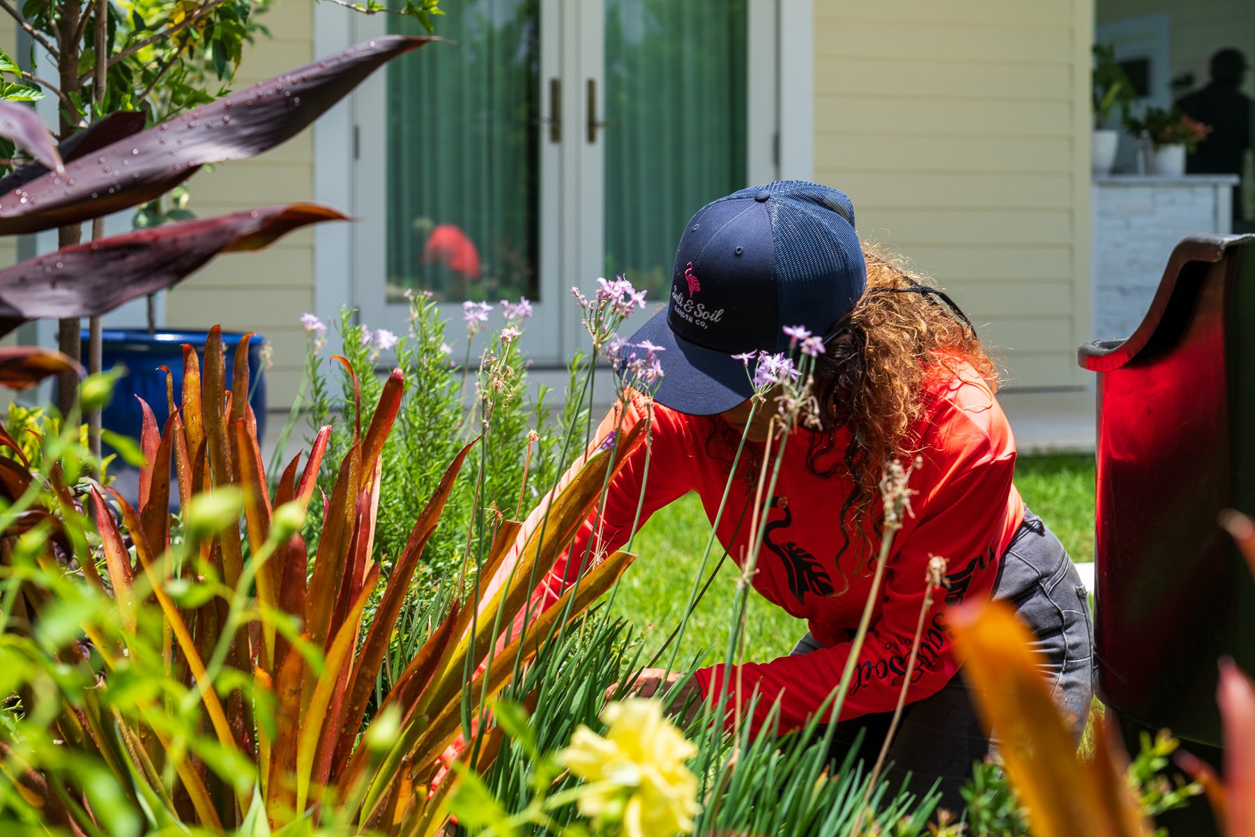 crew cleaning out landscape beds