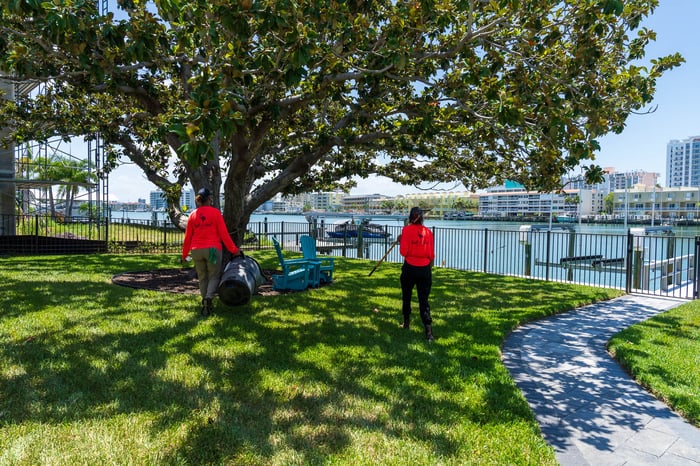 crew cleaning up landscape