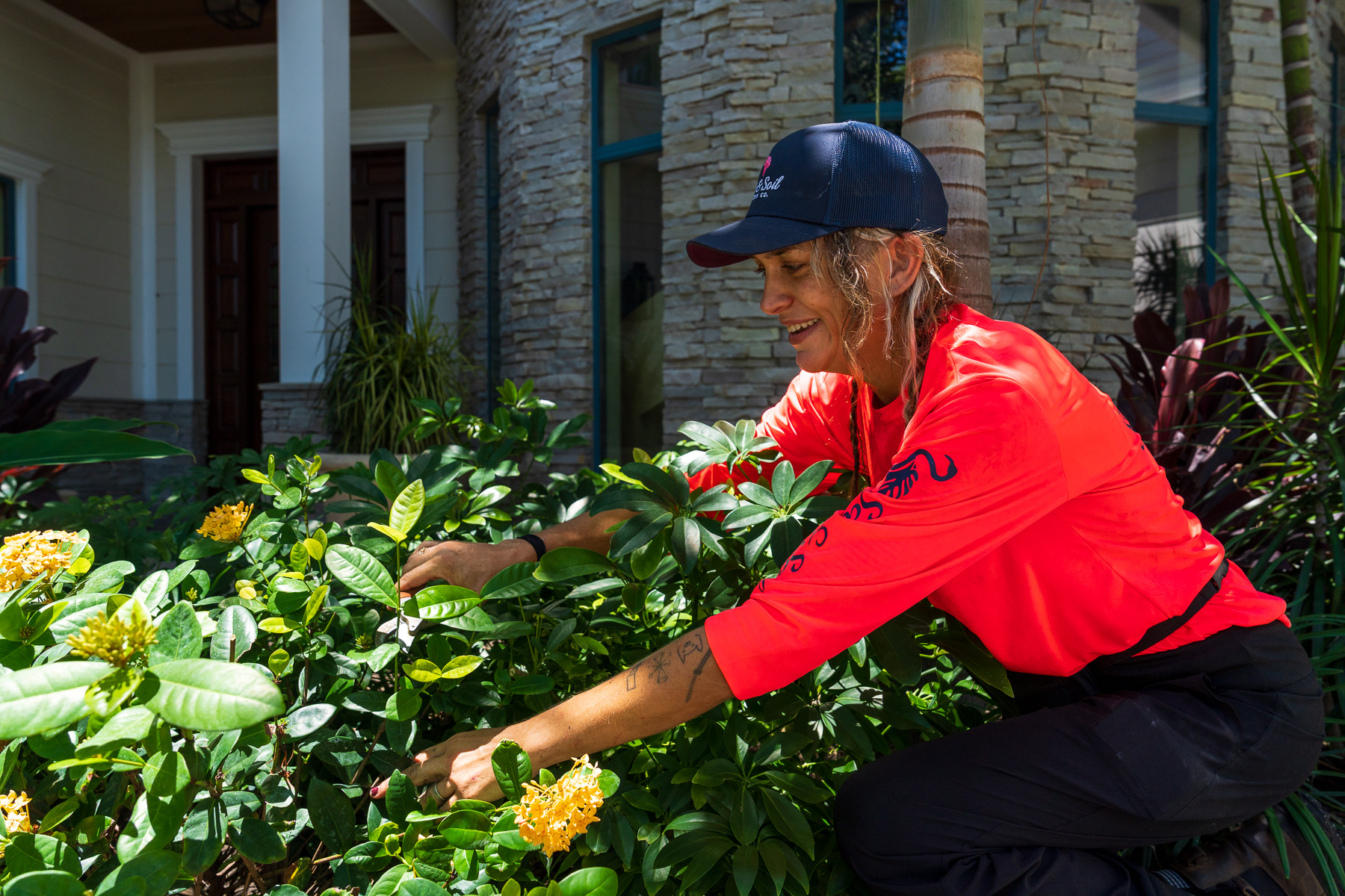 crew pruning back landscape plants-1