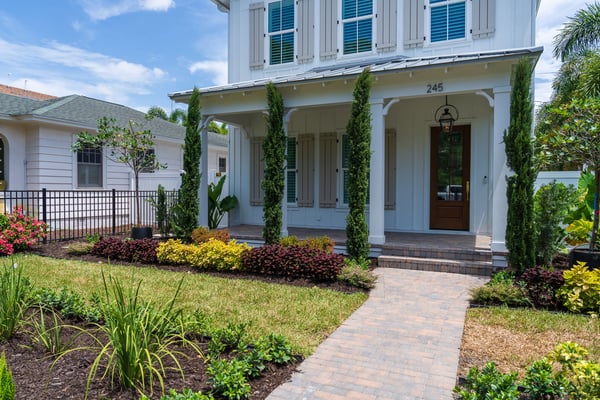 front of house landscape beds paver walkway and porch