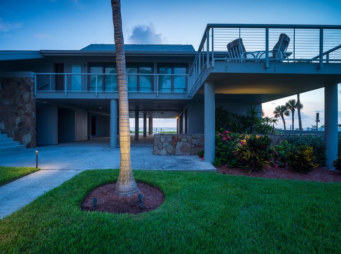 green lawn landscape beds looking at ocean front of house-1
