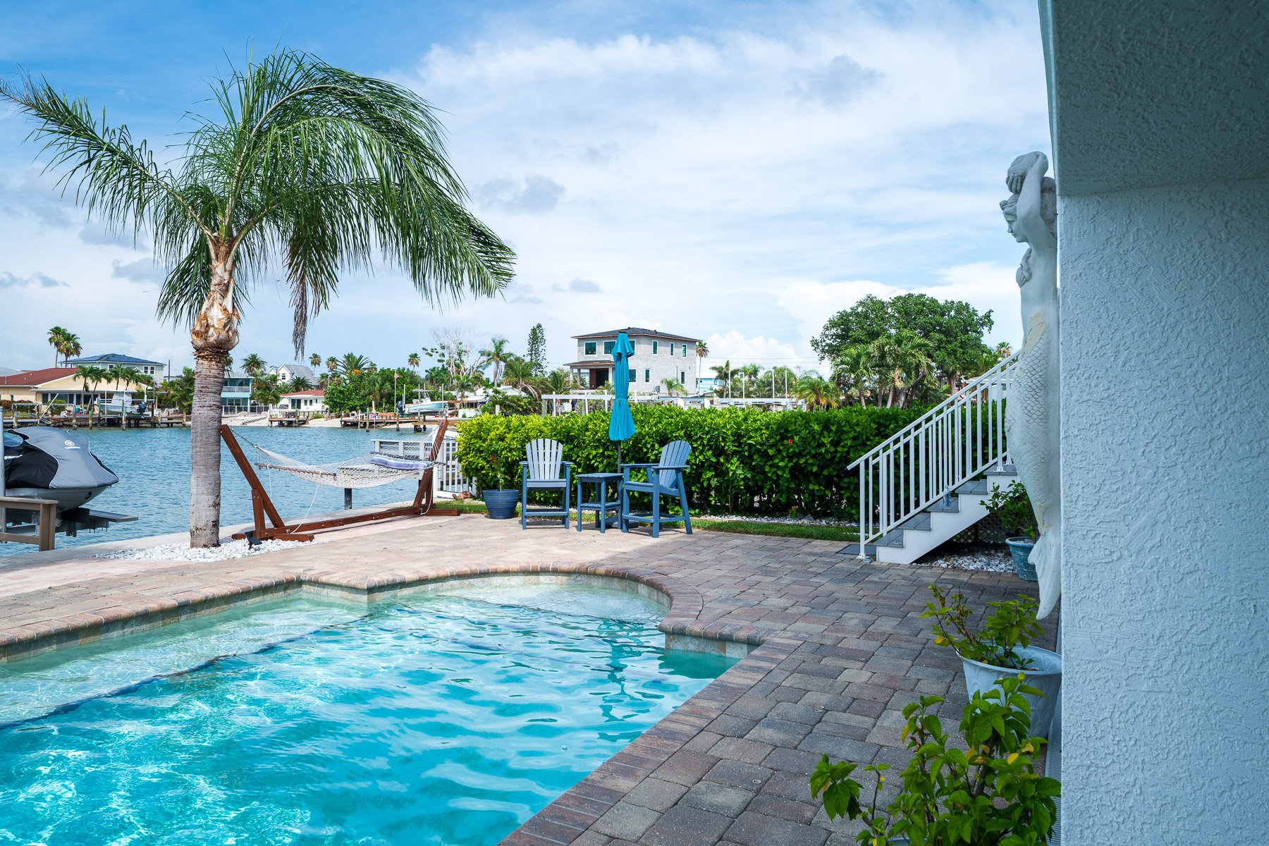 pool near ocean outdoor seating hammock water paver patio 1