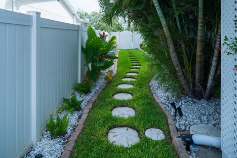 stepping stone path way landscape beds green grass