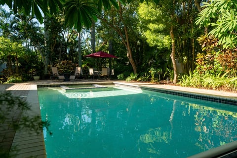 residential pool area with lush landscaping